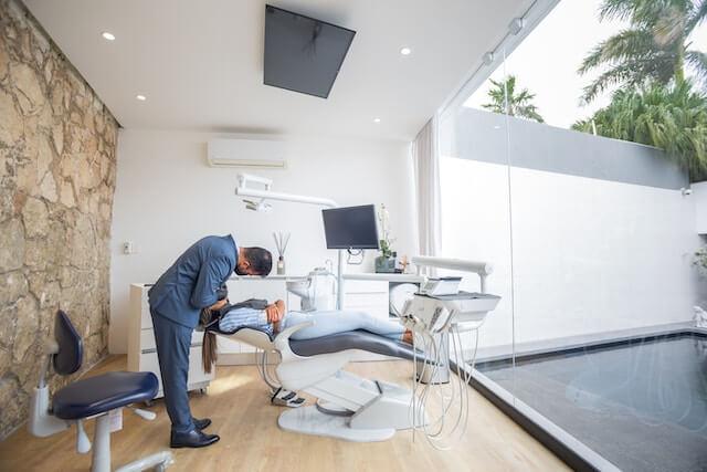 a dentist tending to a patient