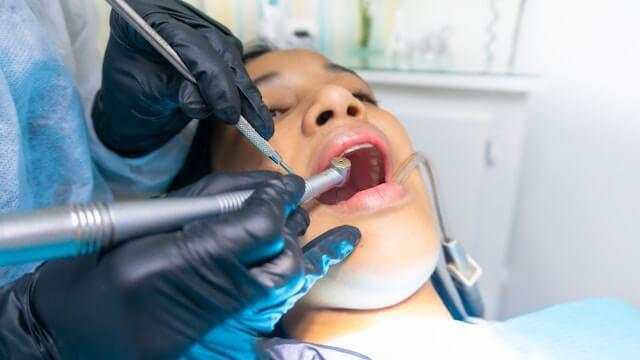 a woman having her dental cleaning